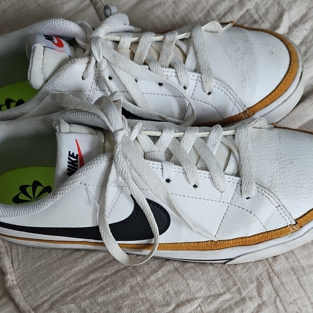 Nike White and Black Sneakers with Gold Accents
